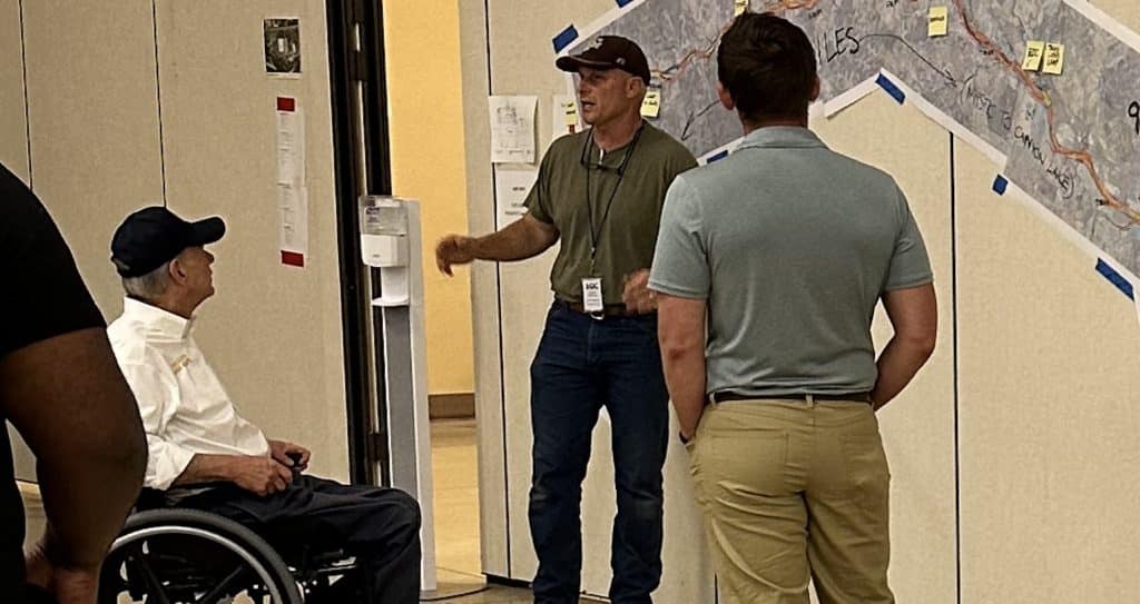 Kerr County Engineer Charlie Hastings provides a briefing to Gov.Greg Abbott.